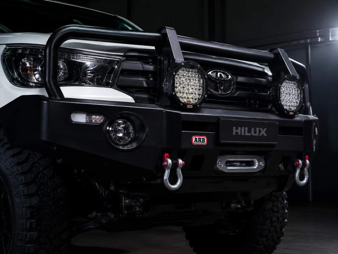 Black steel bullbar with spotlights and recovery shackles on a bakkie